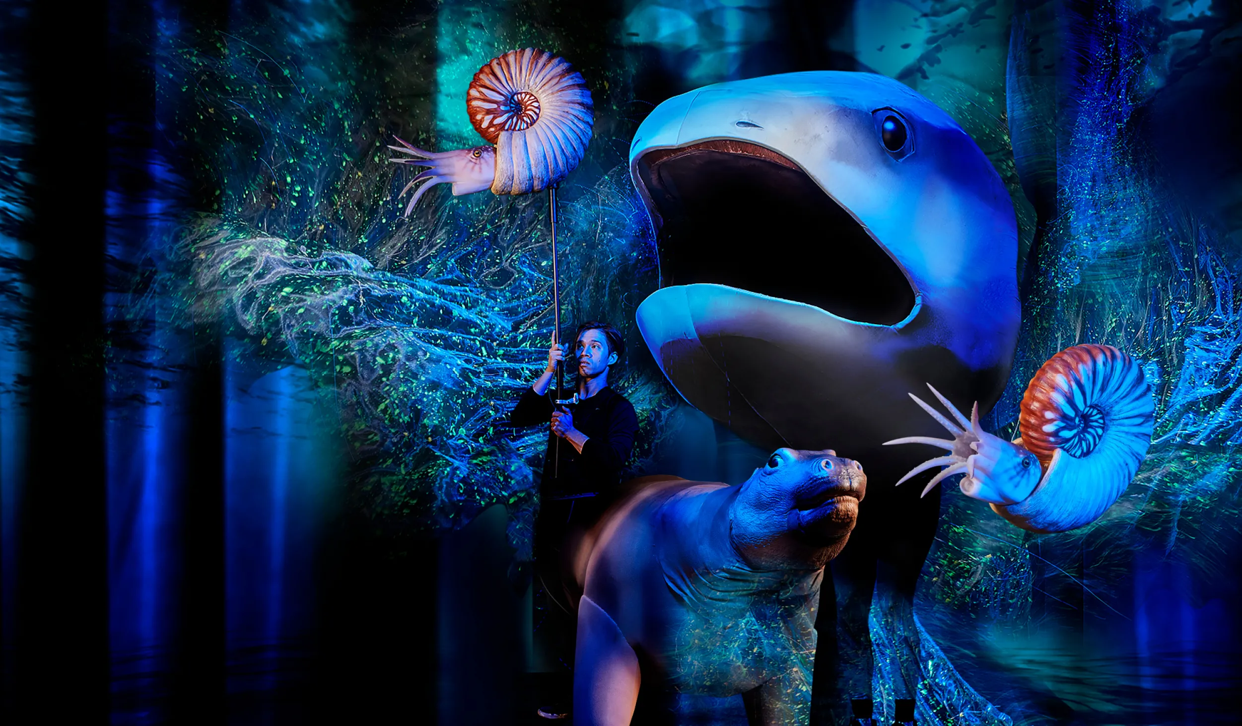 A collage of puppet sea creatures on stage in NHM's Commons Theater