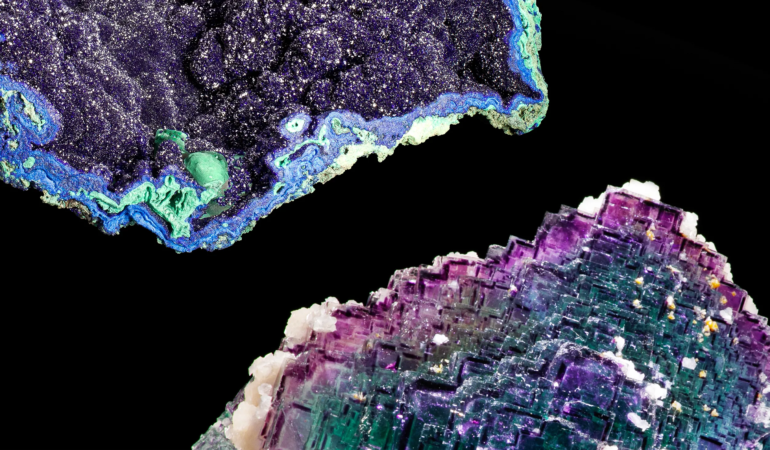 Closeup of two mineral halves, with purple, green, and blue sparkling crystal squares