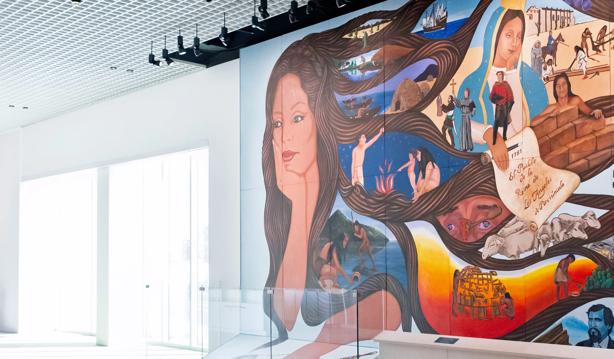 Mural of a woman with head in hand and vignettes within her hair