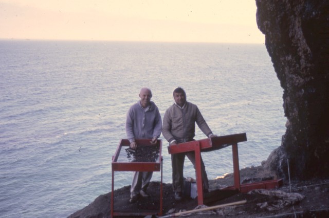 Anthro - Woven Seagrass: Charles Rozaire at Daisy Cave site on San Miguel Island with another man