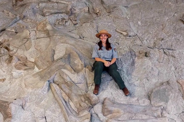 ReBecca Hunt-Foster sitting on an excavation site. 