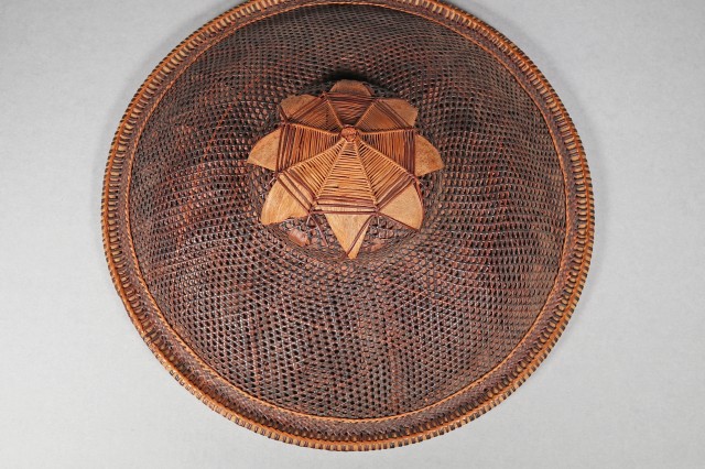 Topside of wide-brimmed salakot made of bark, coconut fibers, palms and rattan.