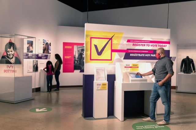 Man registering to vote in exhibition