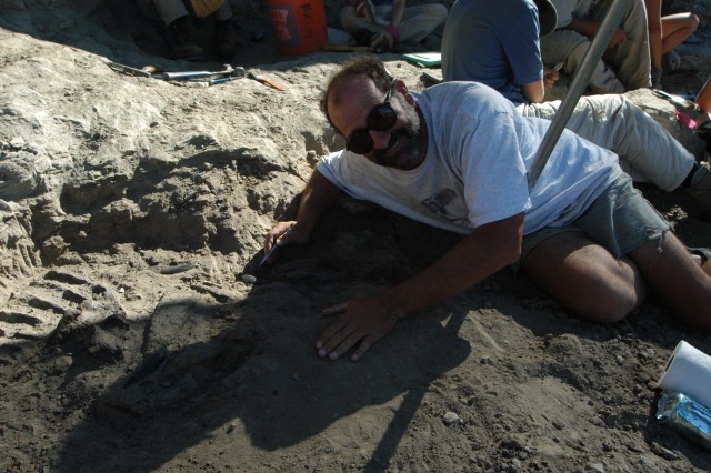 Luis with Fossil at Thomas Excavation