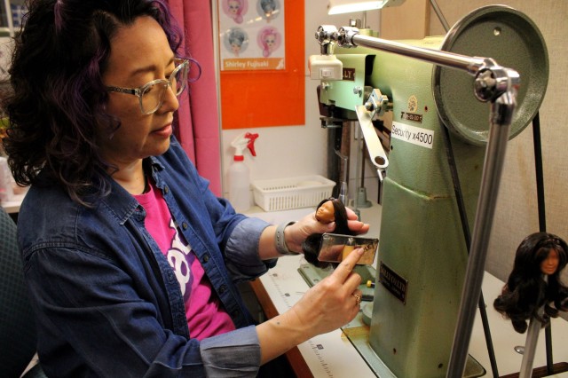 Woman at sewing machine 