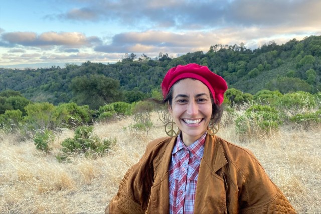 Anjali Berger of TPF smiling in a field