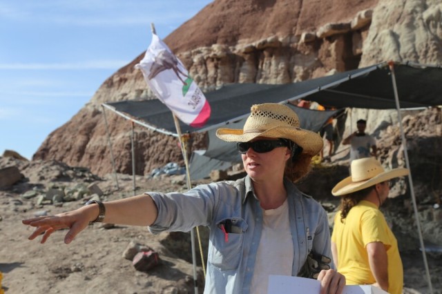 Alyssa Bell wearing at straw hat with a tent and the Gnatalie Quarry in the background