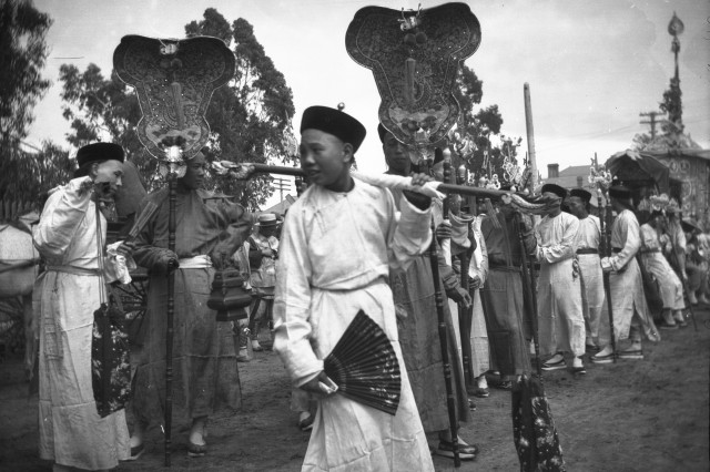 Celebrants prepare for a parade through Old Chinatown