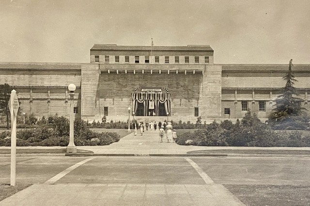 Exterior view of LA County Museum of History, Science and Art south entrance and shows the banner hanging for Olympics fine arts exhibit and competition, 1932, taken by Henry Wylde who later became Chief of Museum Exhibits