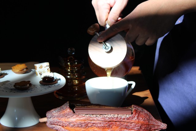 man pours tea