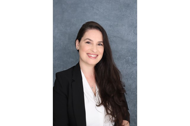 Head and shoulders portrait of Cara Santa Maria wearing a black blazer over a white blouse