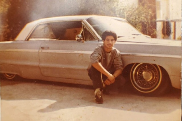A young Raul Ramirez, Sandy&#039;s father, poses with his lowrider.