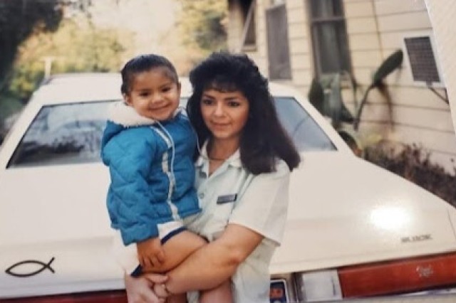 Baby Sandy Avila and her mom lean against the front of her mom&#039;s Regal.