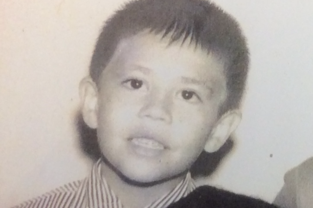 Black and white photos of young Sam Bearpawdepicting a young boy with short hair