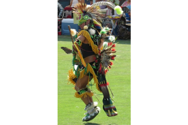 Sam Bearpaw dancing in regalia