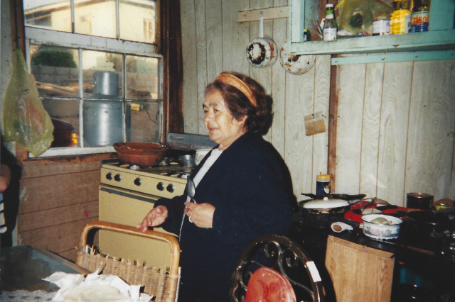 woman preparing food in a home kitchen in Tijuana, Mexico.