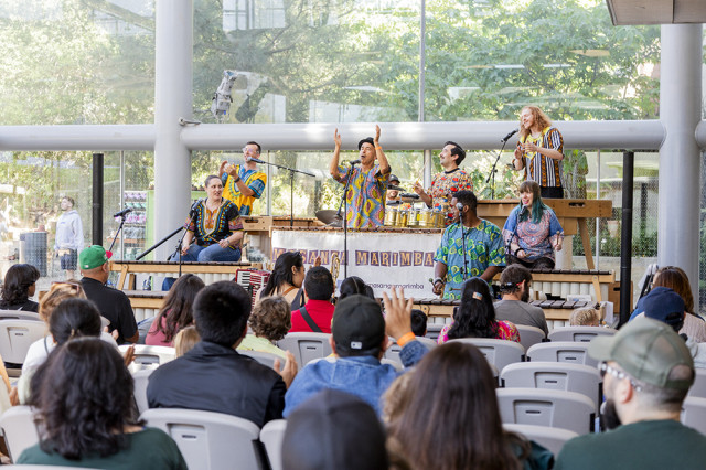 Band performing for a seated crowd