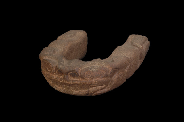 Carved wait yoke worn during Mesoamerican ball games, decorated with Mayan motifs. 
