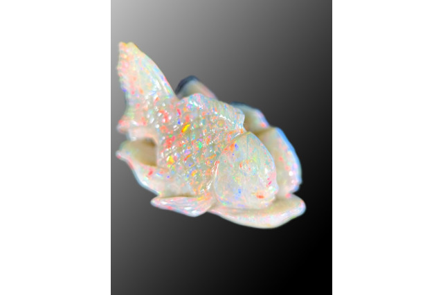 Koi fish carving out of white opal