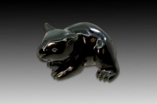 Wombat carved from smooth, dark, nephrite stone