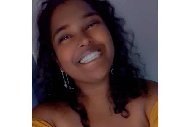 Heading and shoulders portrait of Geetha Chandroth smiling
