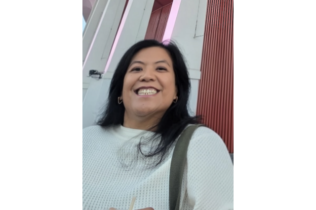 Head and shoulders portrait of Danelle Rubio smiling