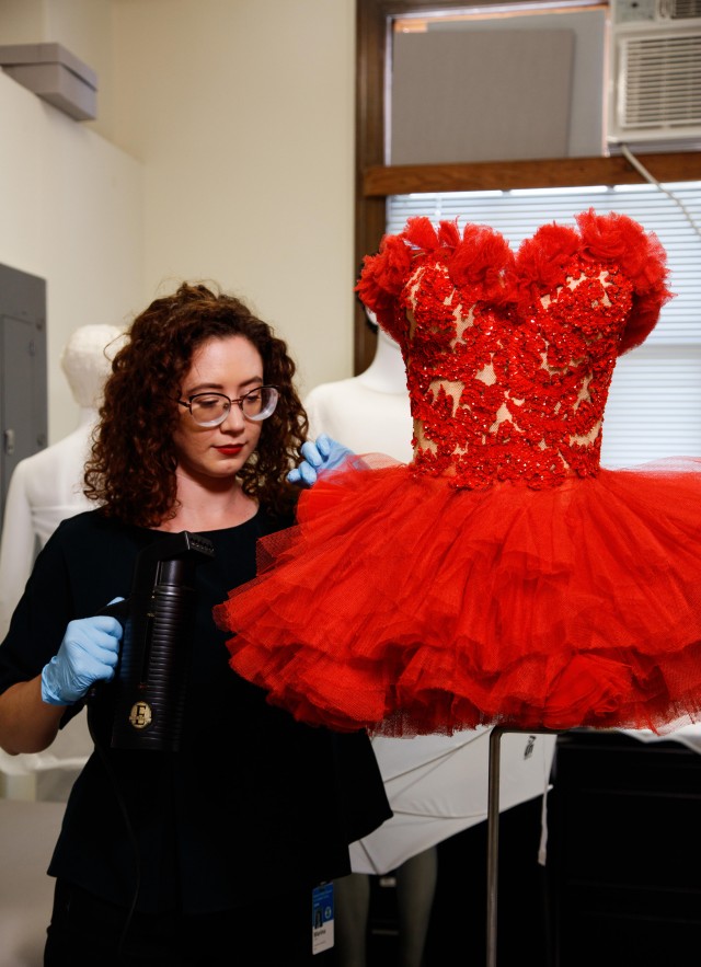 R&amp;C staff working on a red dress