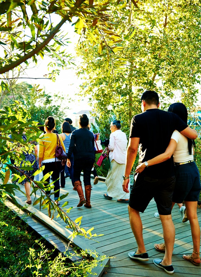 tour group walking through nature gardens nature walk