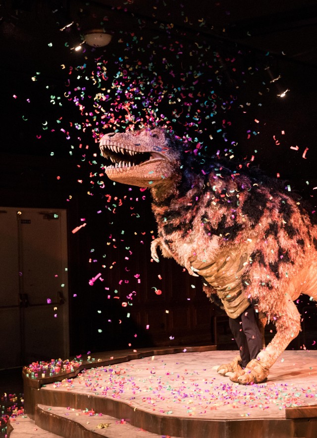 Hunter the T Rex covered in confetti during a Dinosaur Encounters Show at Dino Fest