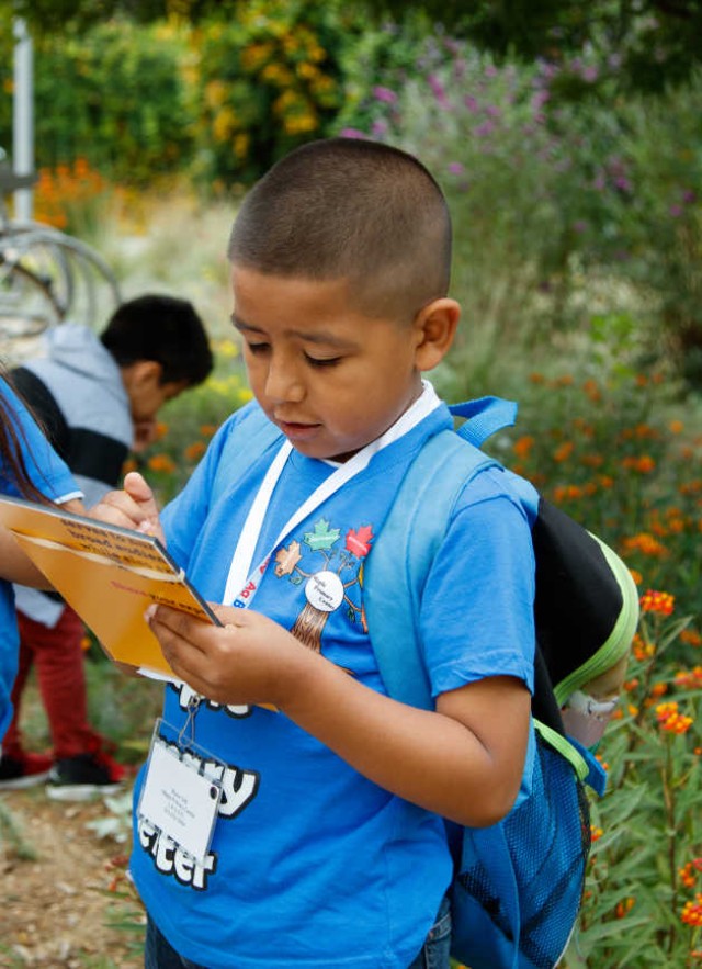 Kids doing a survey in the Nature Gardens.