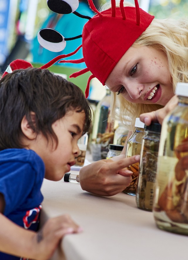 Kid looking at specimens Nature Fe