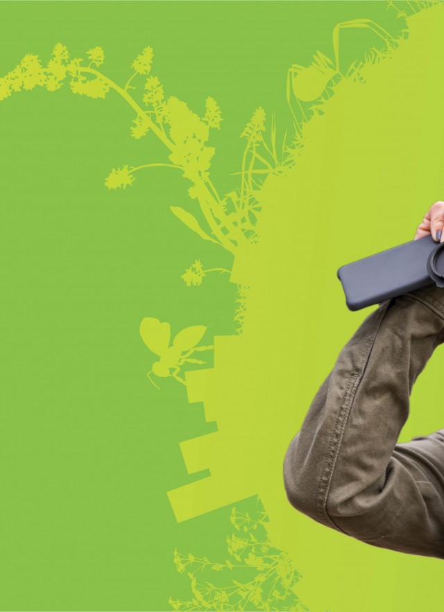 Woman using binoculars to observe nature