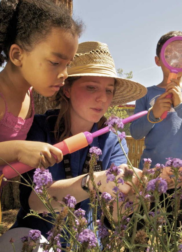 Vanessa Vobis shows children plants in the garden