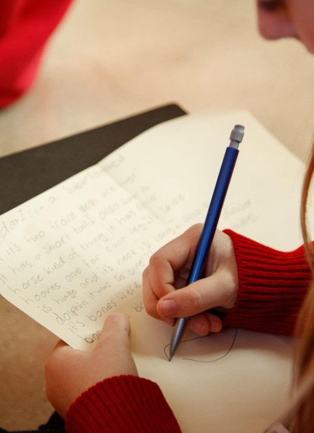 Student taking notes