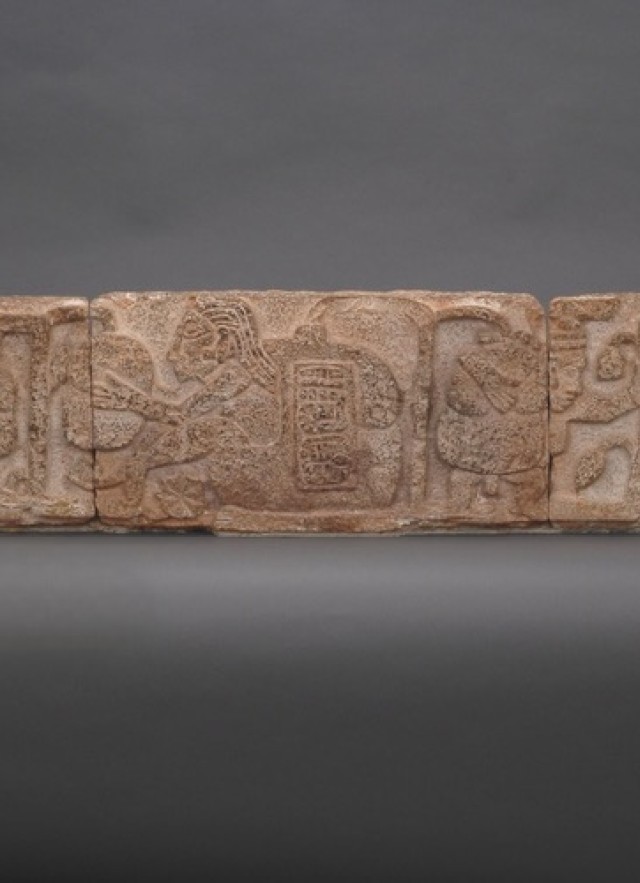 Rectangular stone with Maya glyph depicting a man holding a cacao plant. Campeche, Mexico. AD 600-900.  