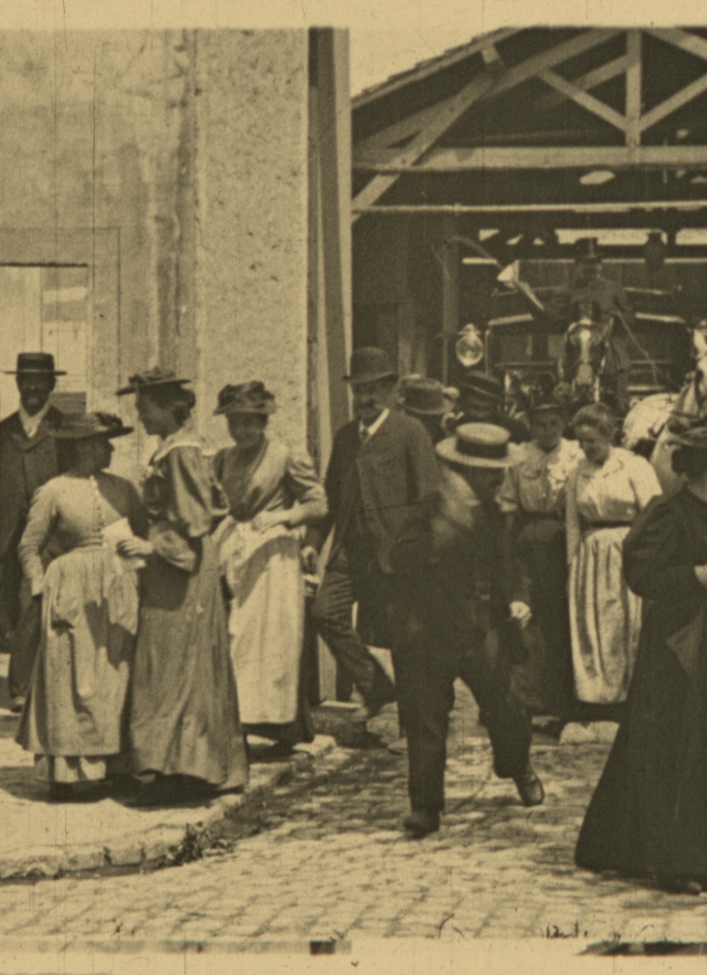  A cropped, single-frame close-up of an original Lumière film frame depicting workers departing the factory.  