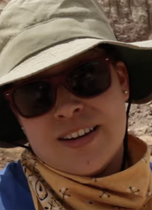 Erika Durazo in hat and sunglasses with mountains in the background
