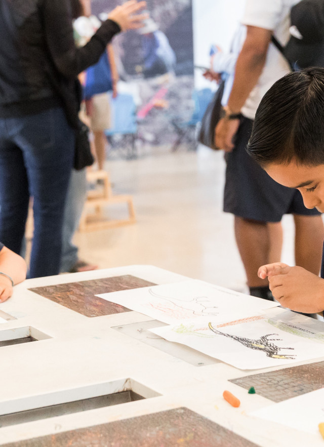 Kids coloring in the discovery center