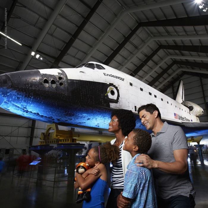 science center guests in front of space shuttle endeavor