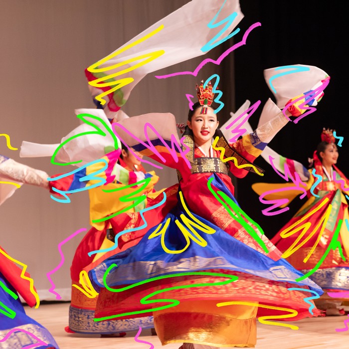 Swirls of colorful lines over twirling dancers