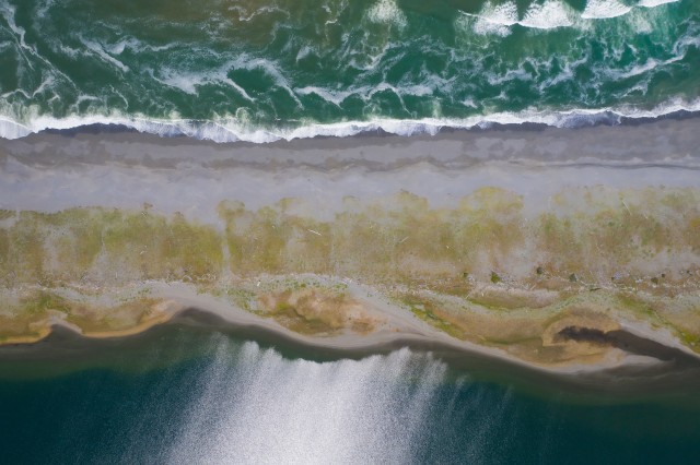 aerial view of waves on a beach