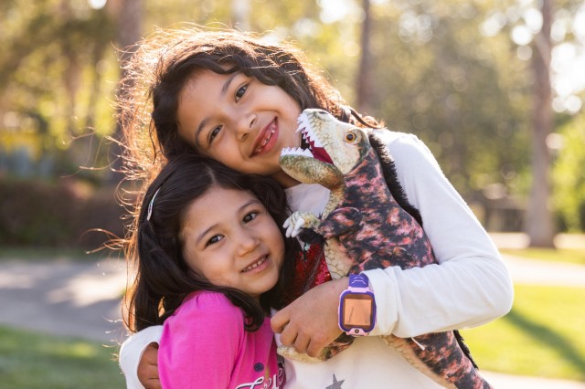 young children with hunter plushie doll