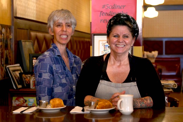 Two women sitting at table