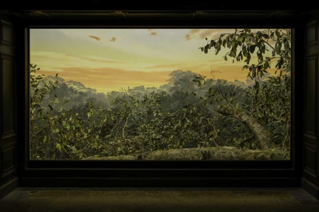 Diorama with painted sunset background and foliage in the foreground