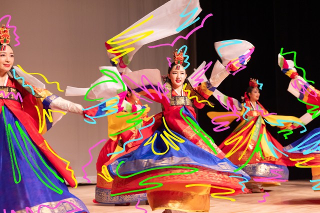 Swirls of colorful lines over twirling dancers