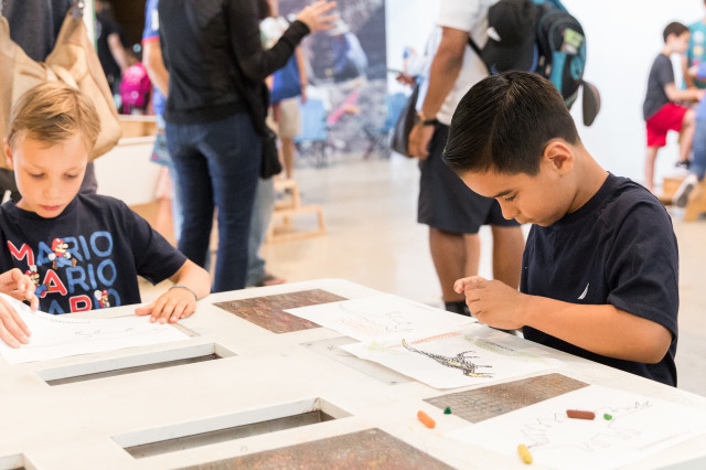 Kids coloring in the discovery center