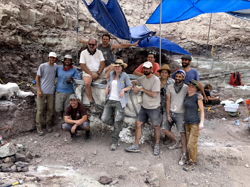 group of paleontologists smile pose for the camera
