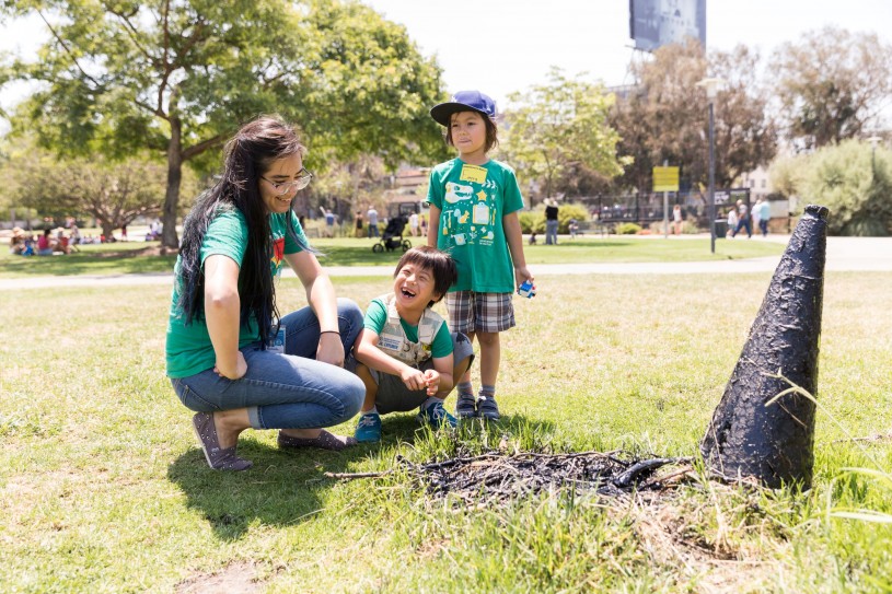 Rochelle Hoffman and two summer camp attendees laughing over a tar pit