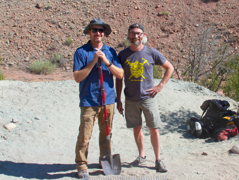 Two men stand next to eachother