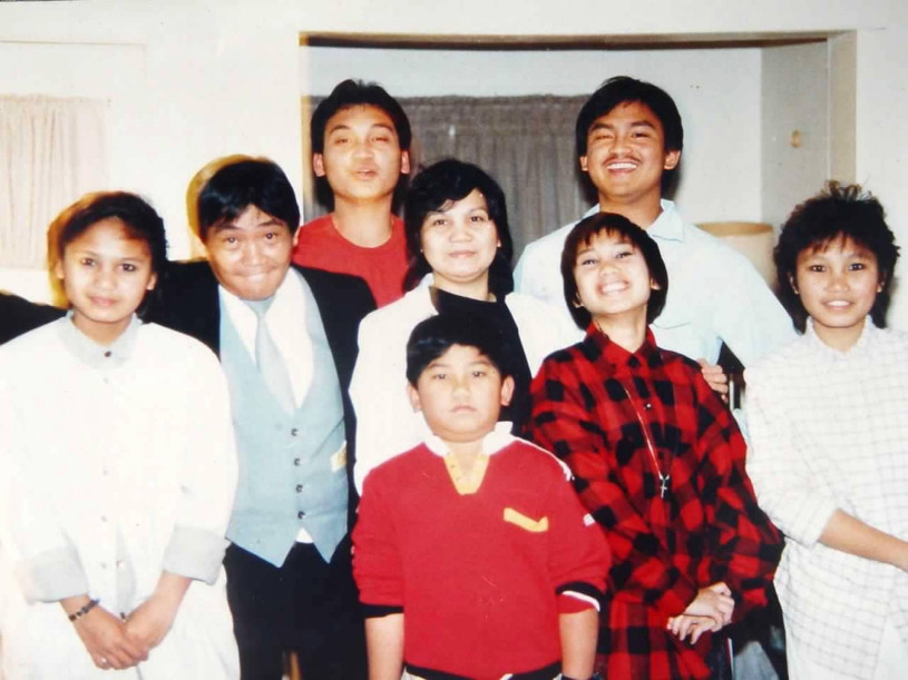 Filipino family photo of four adults and four children together in Historic Filipino Town